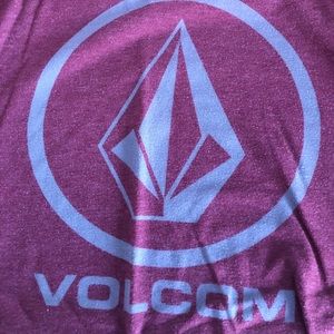 Red volcom shirt.